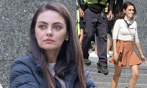 Mila Kunis shows off her toned legs in a ruffled miniskirt while ...